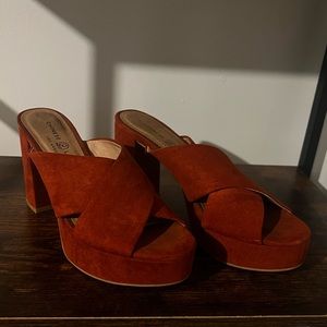 Chunky heeled slides, dark burnt orange.